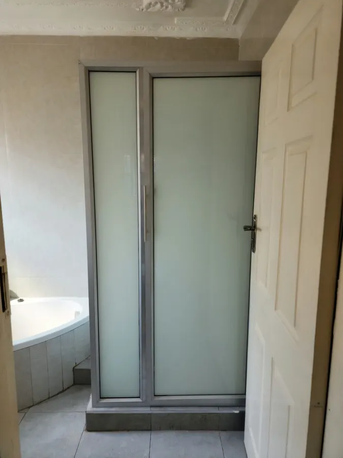 hinged shower cubicle with white glass