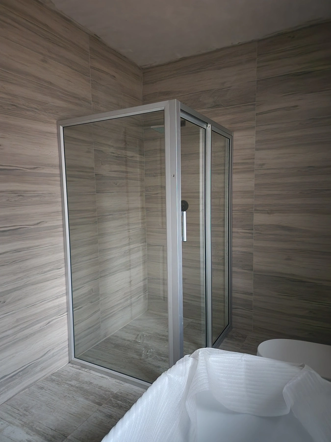 900mm hinged shower cubicle installed in a bathroom by Shower Cubicles Zimbabwe