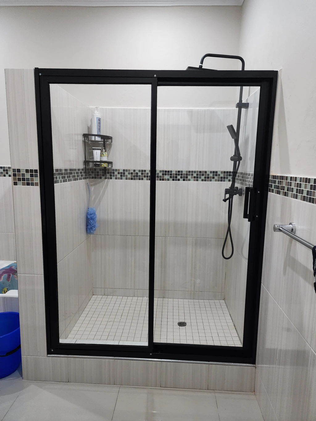 aluminium shower door with black frame and clear glass