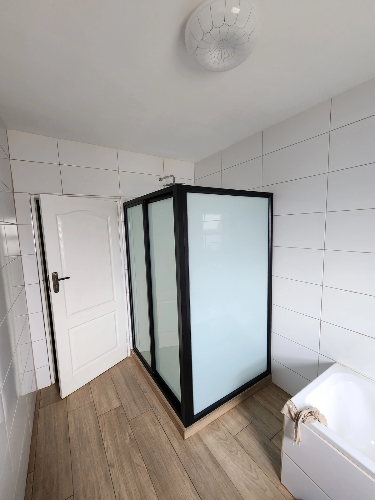 black sliding shower cubicle